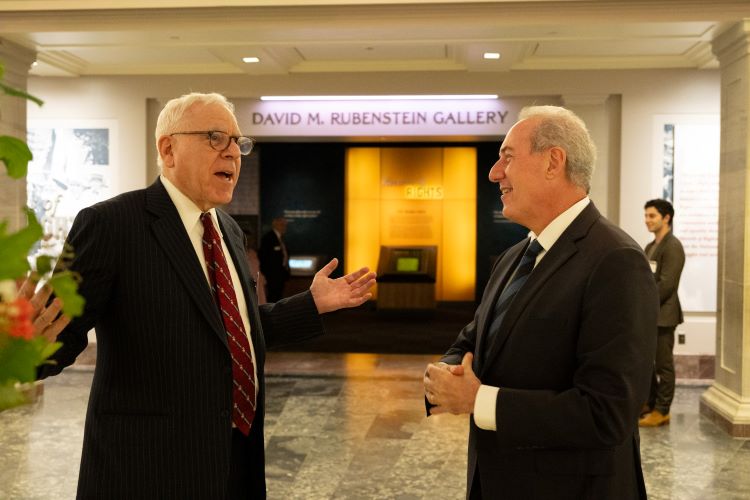 David Rubenstein and Michael Froman outside the David Rubenstein Galleries at the National Archives Museum. Andrea Renda, Francisco de Santibanes, and Tracey Forrest discuss "Geopolitics, Diplomacy, and AI." (Kaveh Sardari)