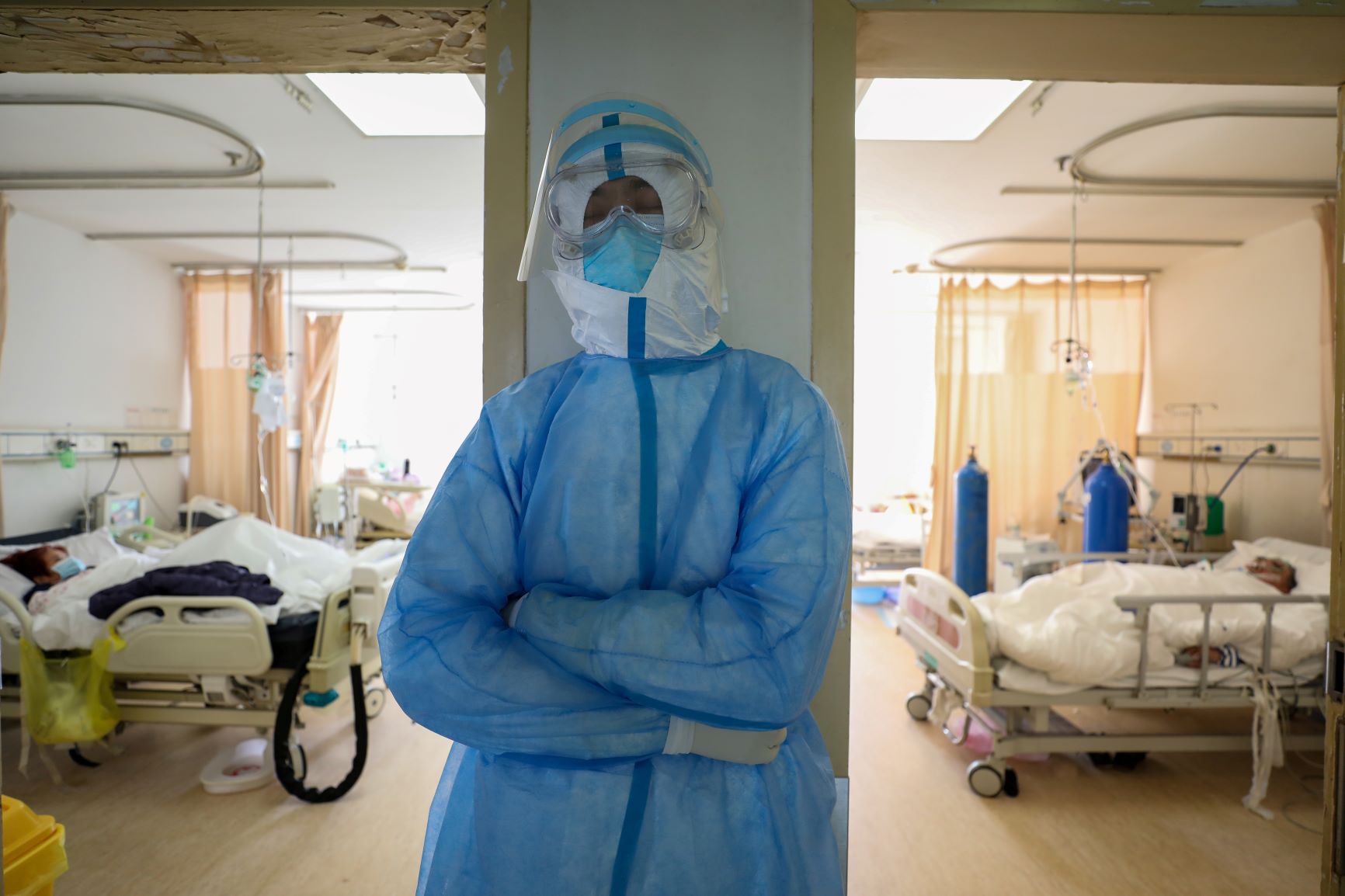 A medical worker in protective suit takes a break at an isolated ward of Wuhan Red Cross Hospital in Wuhan, China on February 16, 2020. 