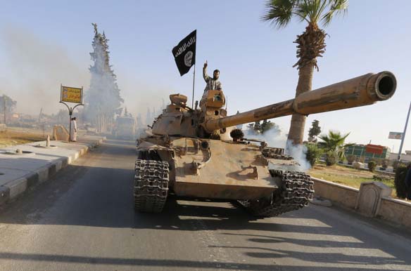 Militant Islamist fighters loyal to ISIS held a parade in Syria's northern Raqqa province to celebrate their declaration of an Islamic "caliphate" after the group captured territory in neighboring Iraq (Stringer/ Courtesy Reuters).