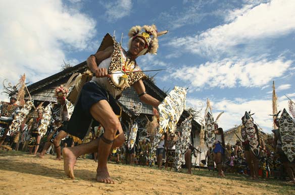 A tribesman from Dayak Kenyah performs a war dance in Indonesia's East Kalimantan province. Indonesia’s many indigenous communities will be represented at the 2014 World Conference on Indigenous Peoples (Yusuf Ahmad/Courtesy Reuters).