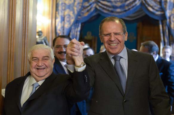 Syrian Foreign Minister Walid al-Moualem and his Russian counterpart Sergei Lavrov enter a hall before the talks in Moscow, January 17, 2014 (Pool/Courtesy Reuters).