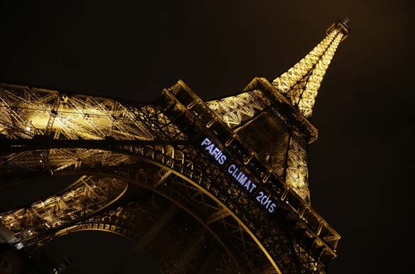 Lights on the Eiffel Tower read, "Paris Climat 2015" to mark the selection of the Paris to host the United Nations Framework Convention on Climate Change Conference of Parties in 2015 (Jacky Naegelen/ Courtesy Reuters).