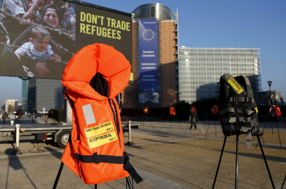 Lifejackets are pictured in front of the European Commission headquarters during a protest by Amnesty International to demand the European Council protect the human rights of the refugees within the EU-Turkey migration deal. (Francois Lenoir/Reuters)